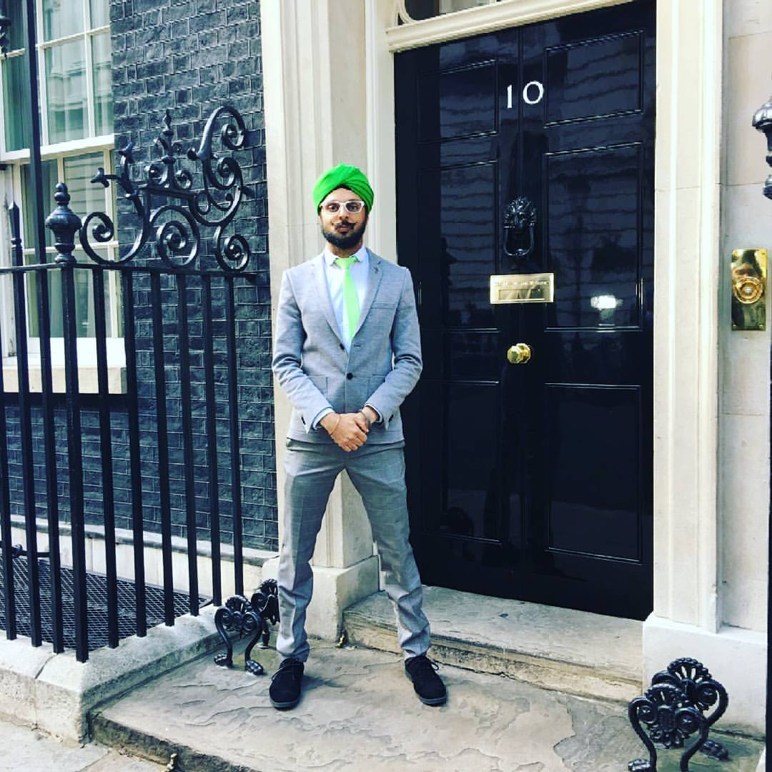 Param outside 10 Downing Street on the day of his MBE presentation 