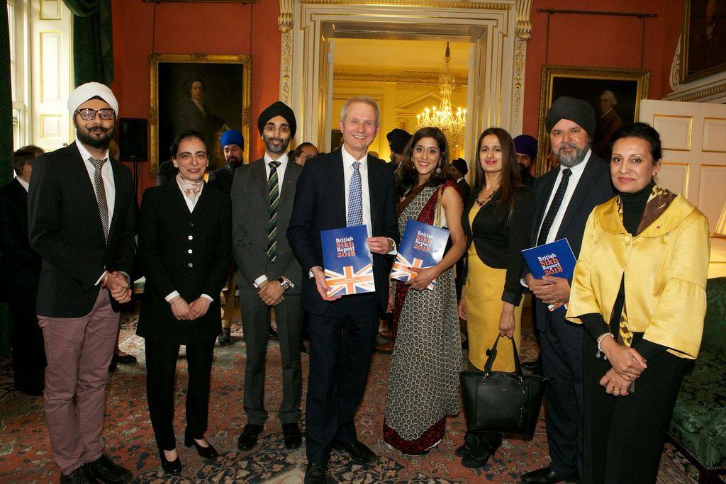 Param presenting a copy of the British Sikh Report to to Sir David Lidington KCB CBE, Deputy Prime Minister, in 2018