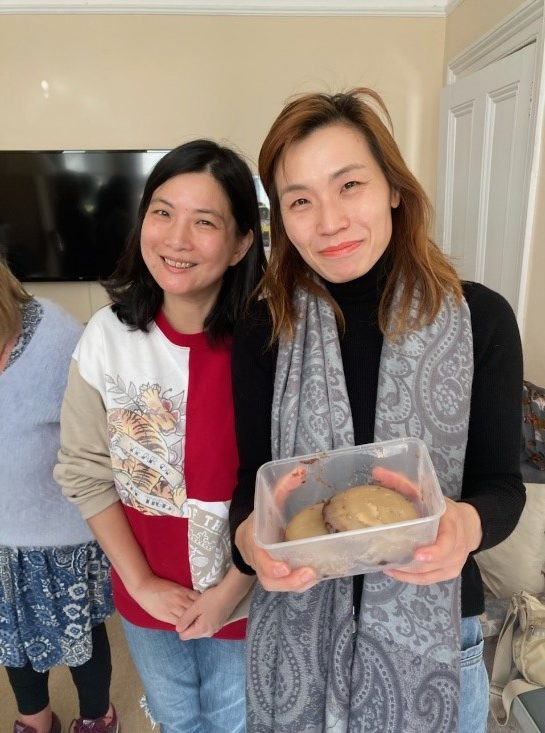 This is Joyce, on the left, who brought chicken wings, and Doris, who had cooked red bean cakes