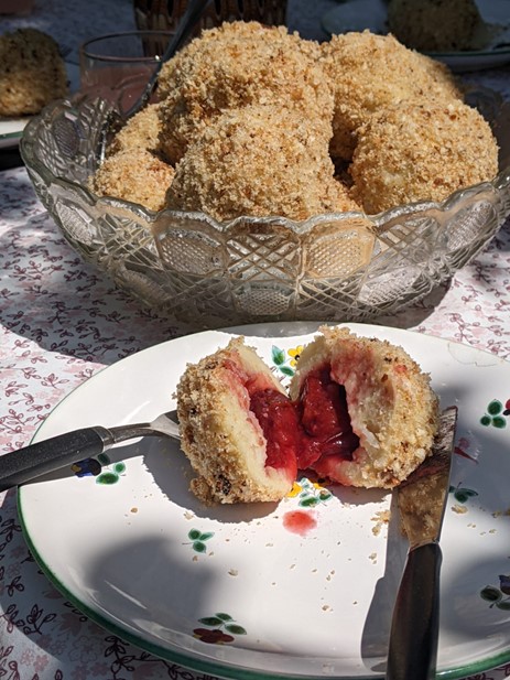 Much loved traditional Romanian plum dumplings made by our hosts. Bread-crumbed potato dough with a plum centre. Eaten with a sprinkle of sugar. 