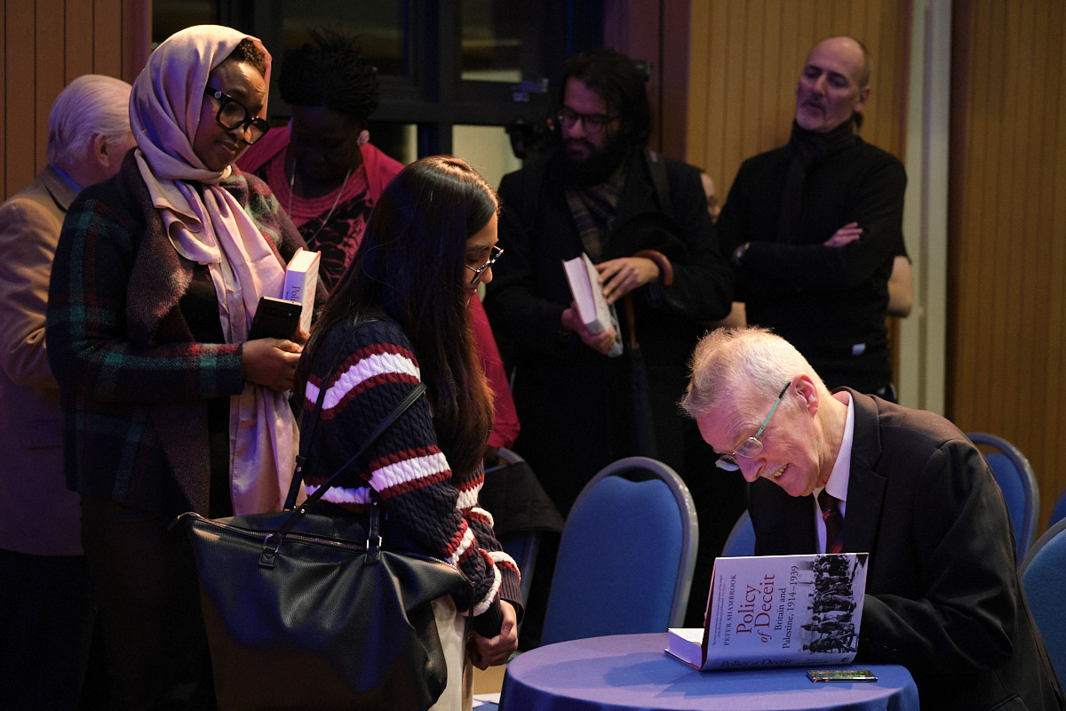 Dr Peter Shambrook signing copies of his book, Policy of Deceit at the event. 
