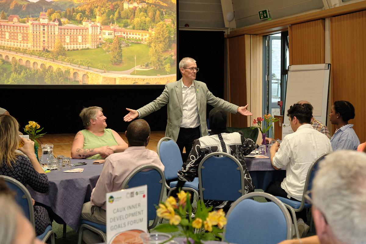 Denis Nowlan, Executive Director of IofC UK reunites with attendees of Caux 